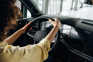 Side close up view of woman that is sitting in the car