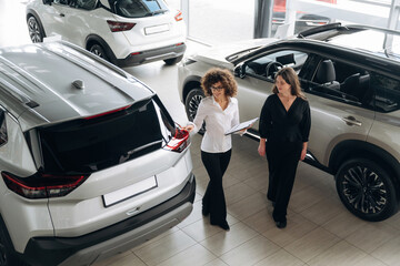 Retail shop worker is helping the customer