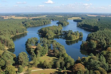 Scenic aerial view of a winding lake surrounded by forests