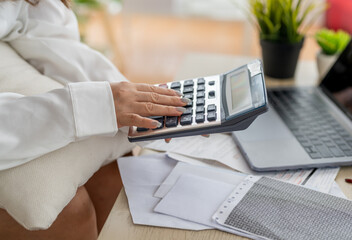 Human use calculator and calculate bills and paying bill, credit card, tax and vat, payment,...