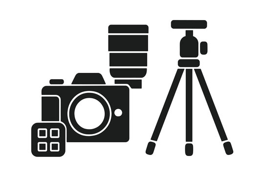 Camera equipment setup with tripod and flash for photography at outdoor event during daytime