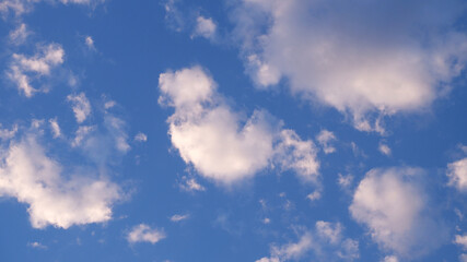 Clouds sky background with soft sunlight. Nature wallpaper of sky and cloud texture. Concept of soft blue, white, high view, good vibe, fluffy, pastel, minimal for print, cover. Sky texture backdrop.
