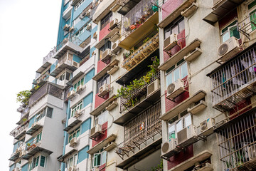 Dense residential area of Macau, with colorful buildings, balconies.