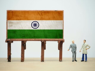 Mini toy of action figure at table with blurred background. Business financial photography concept...