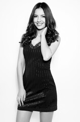 Fototapeta premium Beautiful young woman with long black hair and pretty smile
