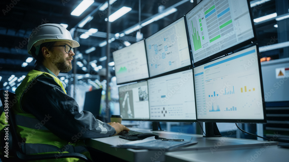 Poster caucasian male process engineer using multi monitor workstation to control production of modern heav