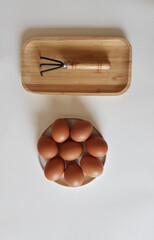 Eggs and Gardening Tool Arrangement on White Surface