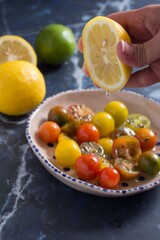 Lemon squeezed over cherry tomatoes.