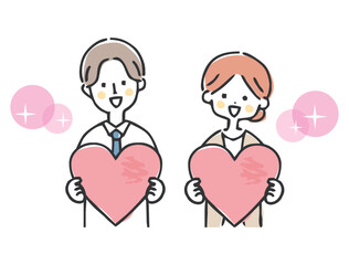 ハートを持っているビジネスマンとビジネスウーマン