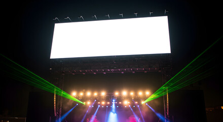 A large blank white screen mockup above a concert stage with a colorful light and laser show at night.