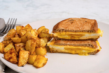 egg melt sandwich with home fries