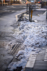 Urban snowy sidewalk in winter