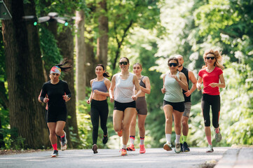Training and jogging. Group of runners are together outdoors