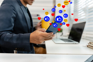 Business man working with smart phones with laptop computers with social media layouts.