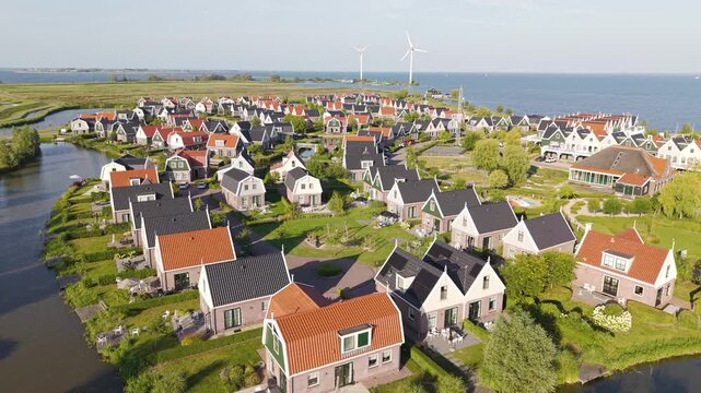 Aerial view of waterfront with holiday houses nearby Amsterdam, The Netherlands, on a sunny summer day