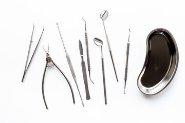 Dental equipment tools for teeth care on white background. Professional Dentist desktop, top view