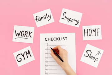 Hand writes in Checklist and many paper cards with hand drawing of different life activities, top...