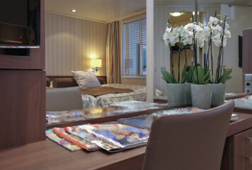 Luxurious suite stateroom cabin room onboard luxury yacht cruise ship cruiseship liner with bedroom...