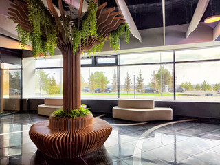 Modern interior design featuring a sculptural tree and large windows in a contemporary space