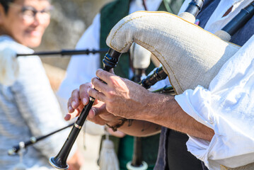The authentic sound and tradition of celtic music in Spain with a bagpiper in costume heritage...