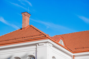 living house frame work top part of building roof tile and chimney objects on blue sky background...