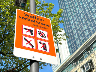 Waffenverbotszone in german, warning sign explicitly prohibiting weapons, No weapons policy, Public...