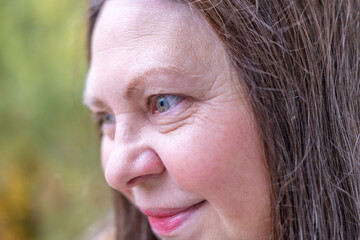 Happy senior woman enjoying fall season in warm beret, in autumn wearing cozy clothes in golden autumn, Natural beauty and joy, self care, healthy positive aging