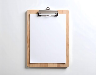 Top view of a wooden clipboard with a blank white sheet of paper attached, isolated on a white background for mockup or notes.