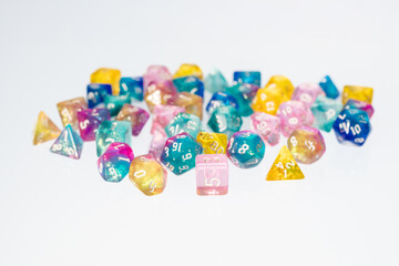 different colours dices for fantasy dnd and rpg tabletop games. Board game polyhedral dices with different sides isolated on white background
