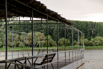 Wooden pier near the river close-up