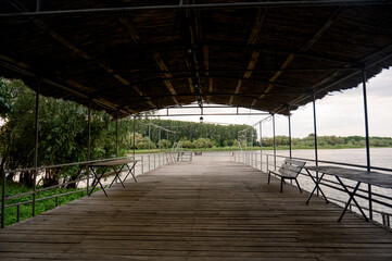 Wooden pier near the river close-up