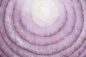 Sliced red onion on white background. Closeup.