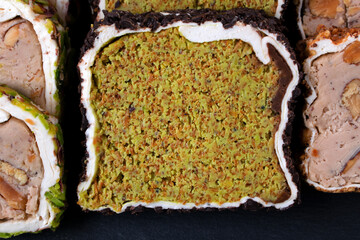 Sliced ​​Turkish delight roll with cream filling, pistachio, almond and hazelnut. Local name:...