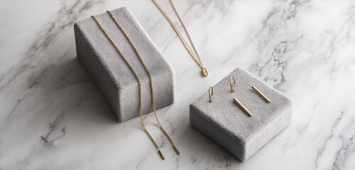 Modern minimalist jewelry set on gray velvet and white marble contrast