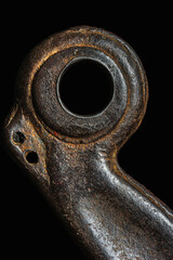 Old steel casting with a hole, crane hook component, close-up of steel structure