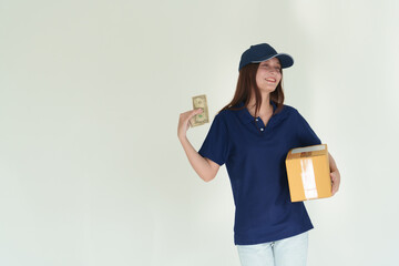 Beautiful delivery girl in blue shirt on white wall background
