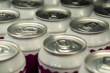 Close Up Shot of Many White Cans Lined Up