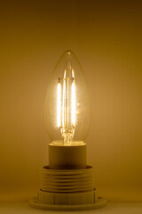 Close Up Of A Warm Light Bulb Illuminating A Wall