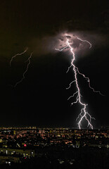 thunderstorm and lightning over the night city