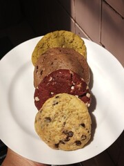 Freshly baked cookies with a golden-brown finish and chocolate chips. Perfectly crisp on the edges with a soft center, offering a delicious, comforting treat for any occasion.