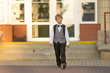 Cute first grade school child,  going to school. First day at school for a firstgrader, child...