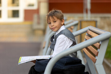 Cute first grade school child,  going to school. First day at school for a firstgrader, child...