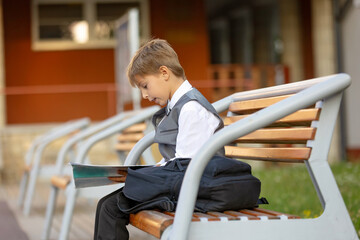 Cute first grade school child,  going to school. First day at school for a firstgrader, child...
