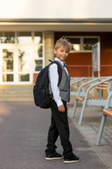 Cute first grade school child,  going to school. First day at school for a firstgrader, child...