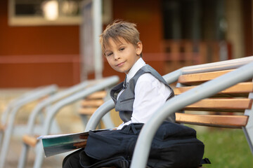Cute first grade school child,  going to school. First day at school for a firstgrader, child...