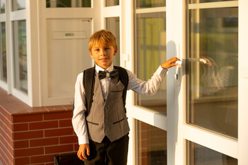 Cute first grade school child,  going to school. First day at school for a firstgrader, child...