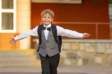 Cute first grade school child,  going to school. First day at school for a firstgrader, child...