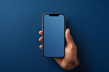 Hand holding modern smartphone with blue screen mobile