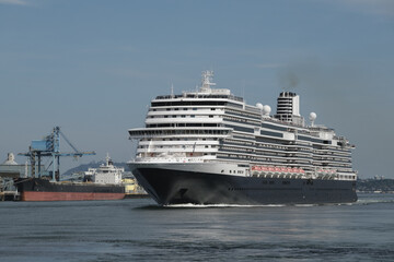 Modern luxury cruiseship cruise ship liner Koningsdam, Nieuw Statendam or Rotterdam departure sail away from Vancouver BC port, Canada for Alaska cruise with breathtaking nature landscape scenery