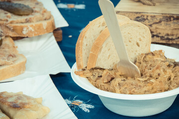 Traditional polish dish bigos and pieces of wheat bread